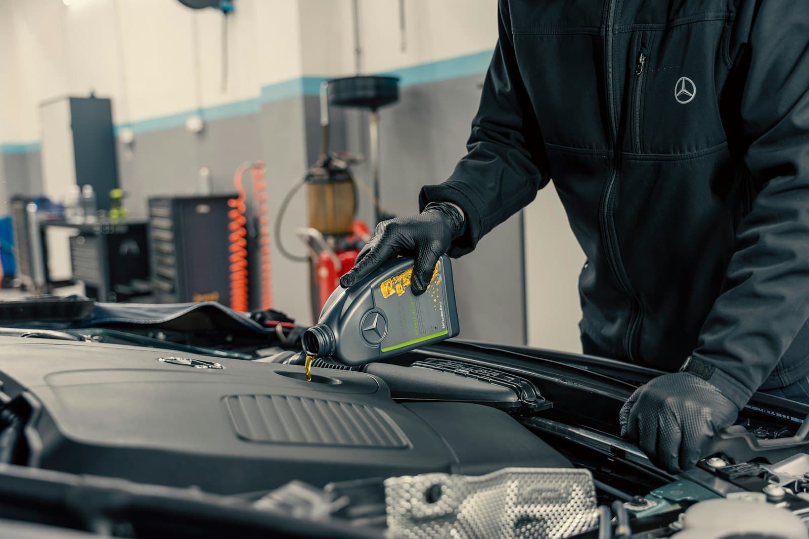 Engine oil being poured during a service